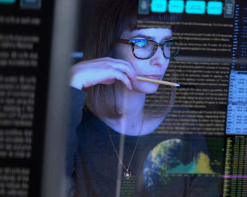 a woman monitors traffic spikes in real time
