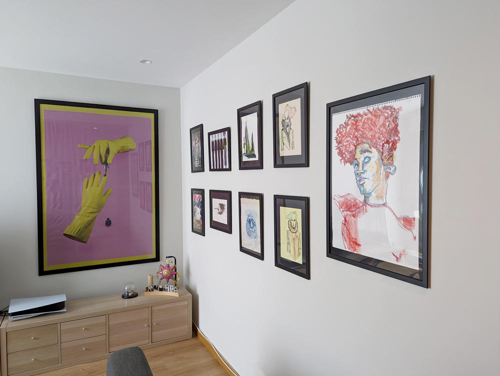 Gallery wall displaying several art pieces.