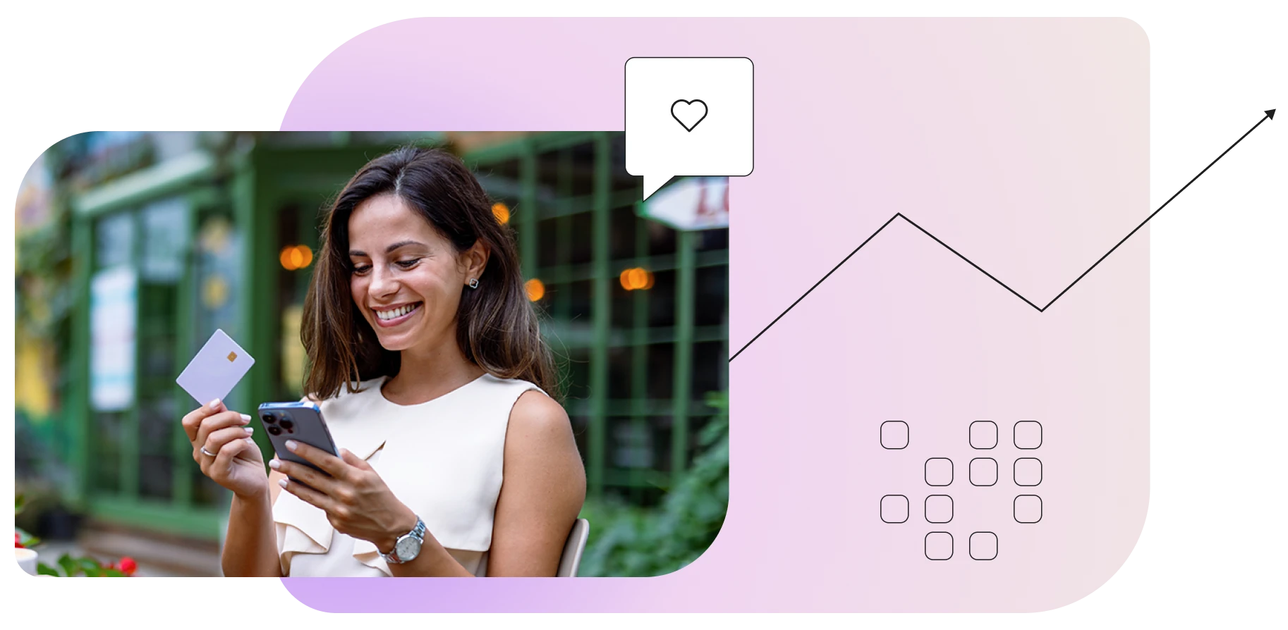 Woman holding credit card looking at phone