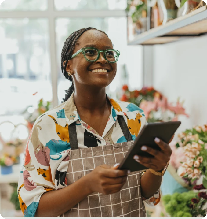 woman with ipad runs her enterprise ecommerce store seamlessly.