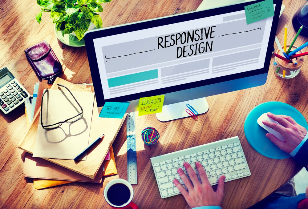 Person building a responsive homepage example